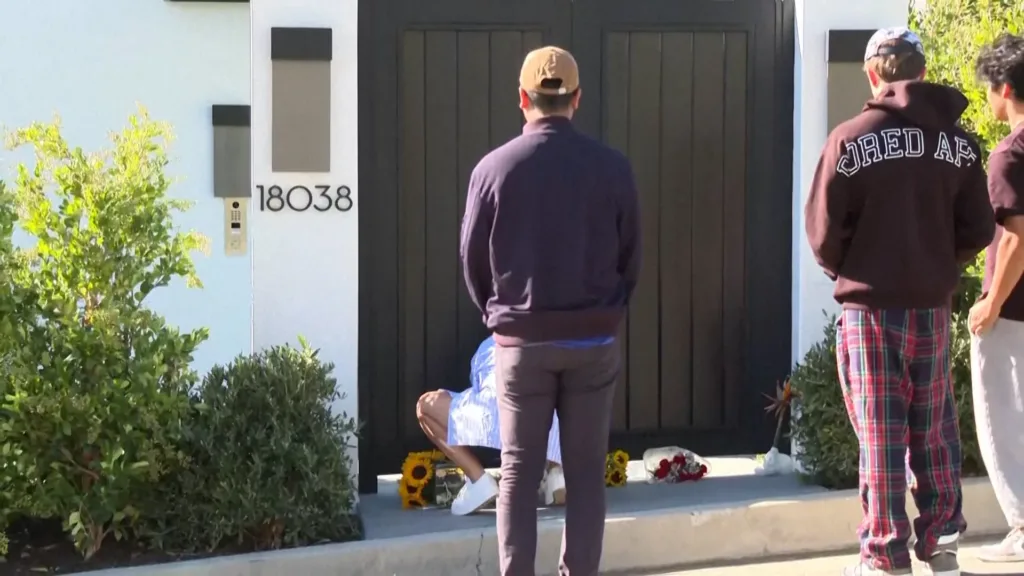 fans outside matthew perry apartment paying tribute